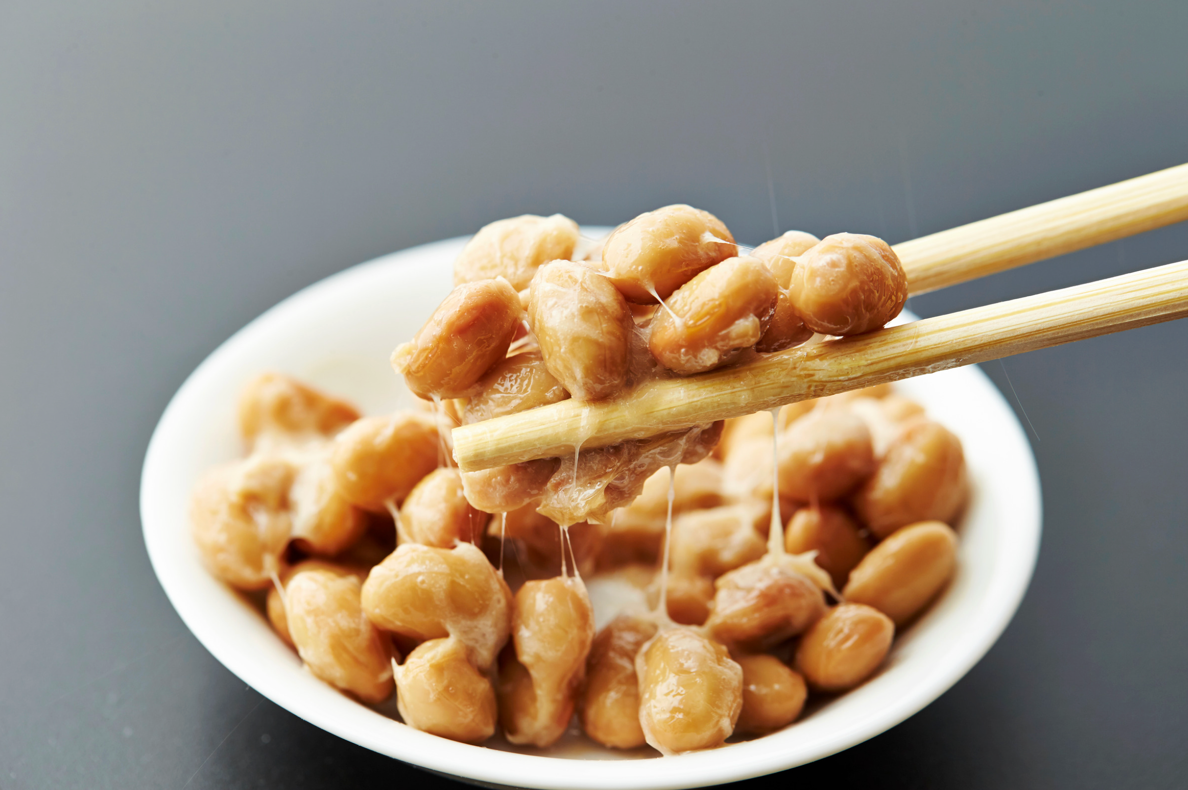 Bowl of fermented soybeans with chopsticks