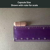 Dr. Murray's Lipizorb C Plus With Red Orange Complex — 60 Vegan capsule size shown with a ruler for scale on a gray background