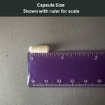 Dr. Murray's Lithium 1 mg capsule size shown with a ruler for scale on a gray background