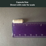 Dr. Murray's Lithium 5mg capsule size shown with a ruler for scale on a gray background