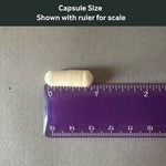 Dr. Murray's Lithium Plus Magnesium capsule size shown with a ruler for scale on a gray background