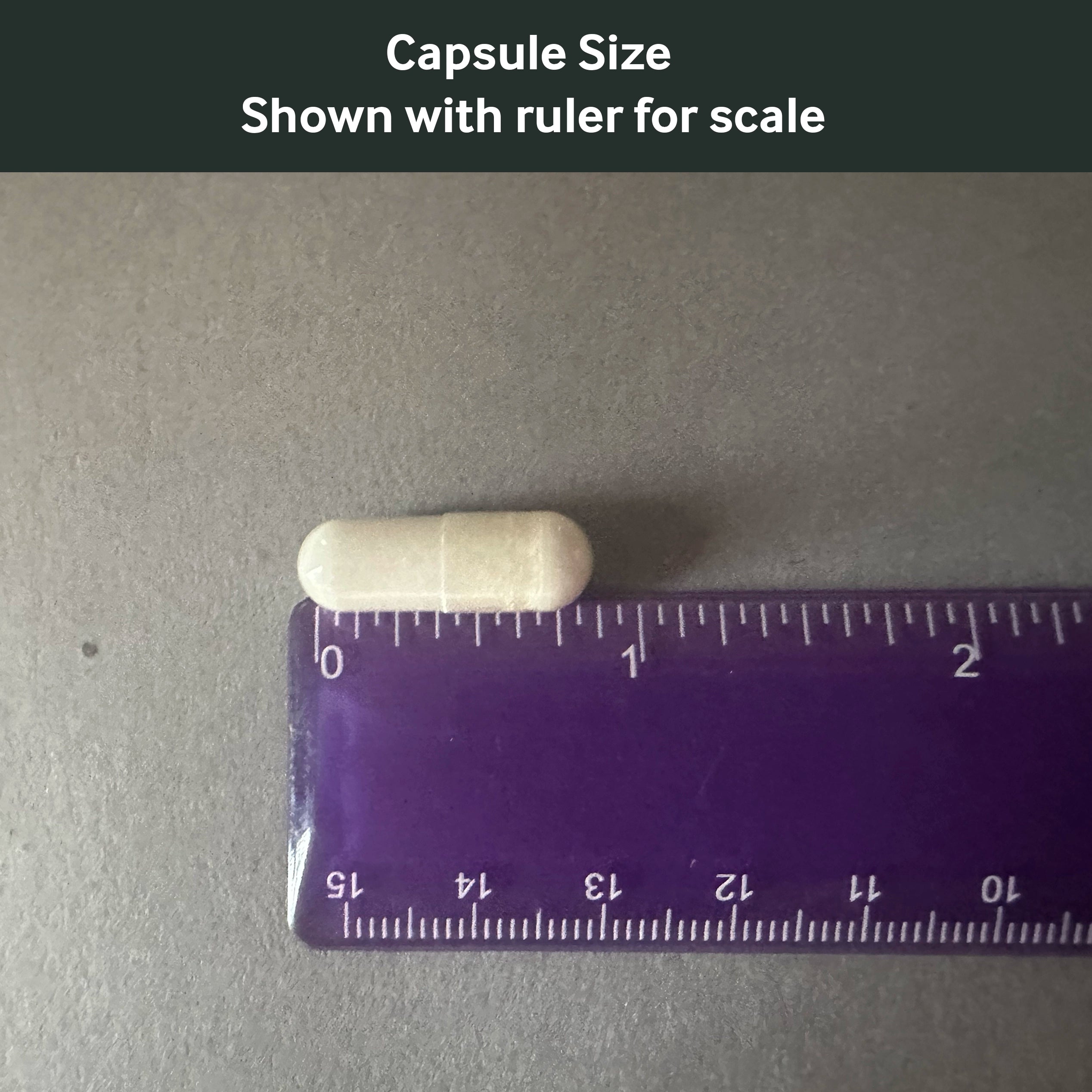 Dr. Murray's N-Acetylcysteine capsule size shown with a ruler for scale on a gray background