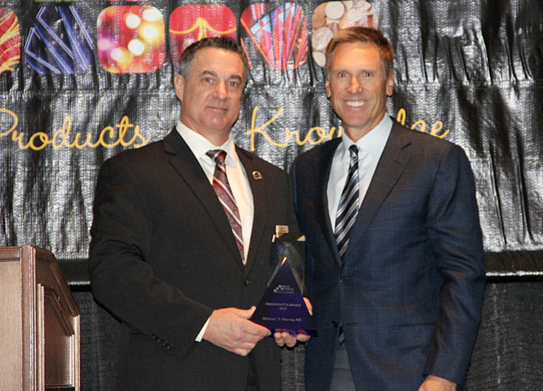 Dr. Murray receiving an award at the  Natural Factors’ Presidents Award Press Release