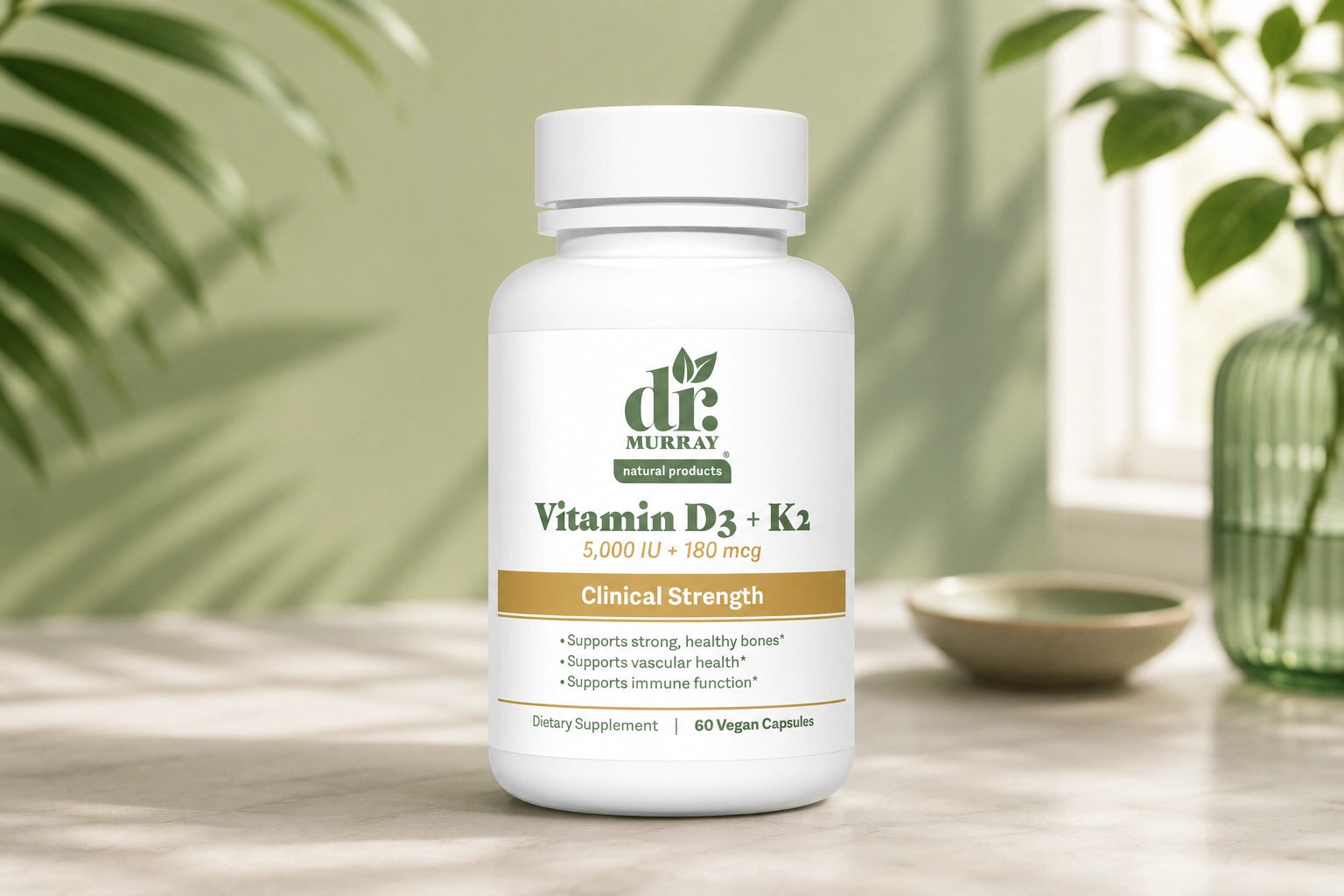 Bottle of Dr. Murray Vitamin D3 + K2 on a wooden surface with a natural background
