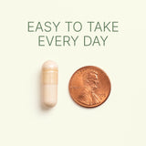 Dr. Murray Serrapeptase capsule is shown next to a U.S. penny for size comparison