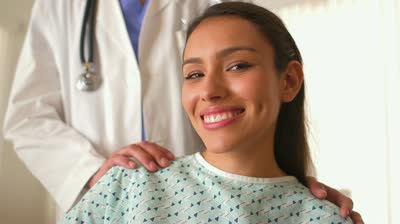 stock-footage-happy-mexican-patient-sitting-in-doctor-s-office